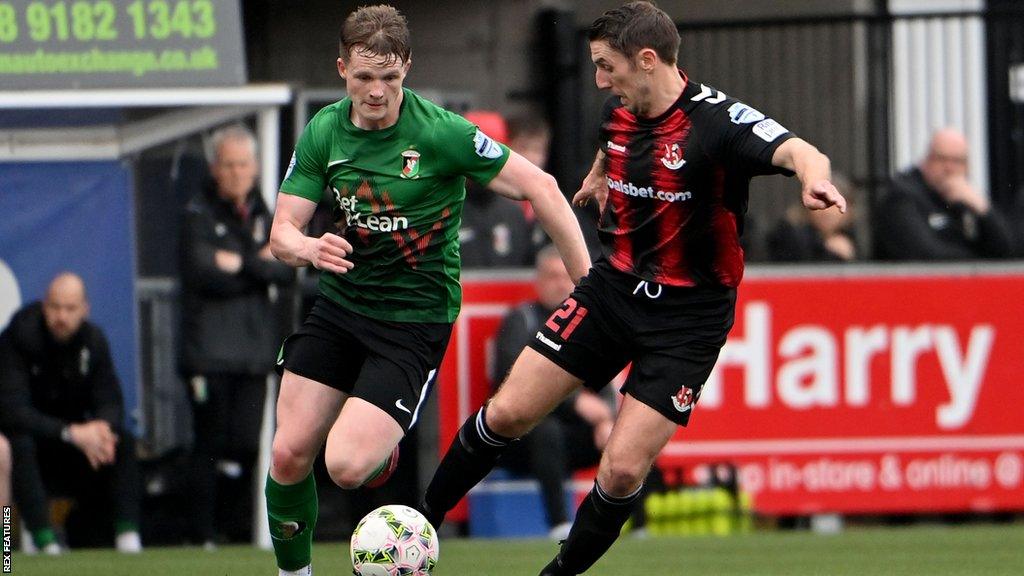 Portsmouth have signed midfielder Terry Devlin from Irish Premiership side Glentoran.