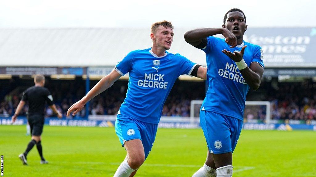 Peterborough United players celebrating a goal