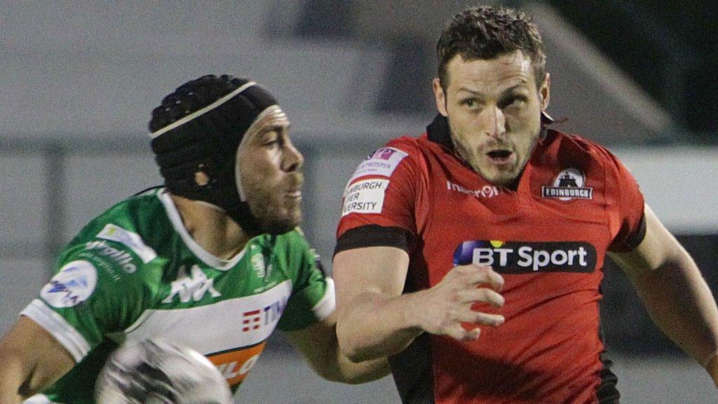 Treviso's Edoardo Gori tackles Edinburgh's Jason Tovey