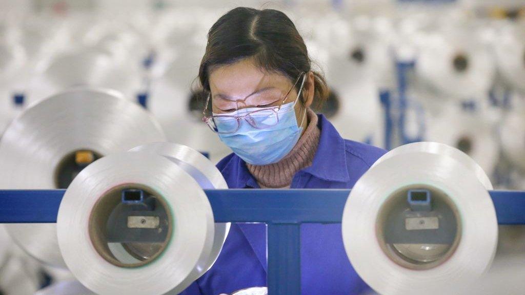 Chinese employee working in factory