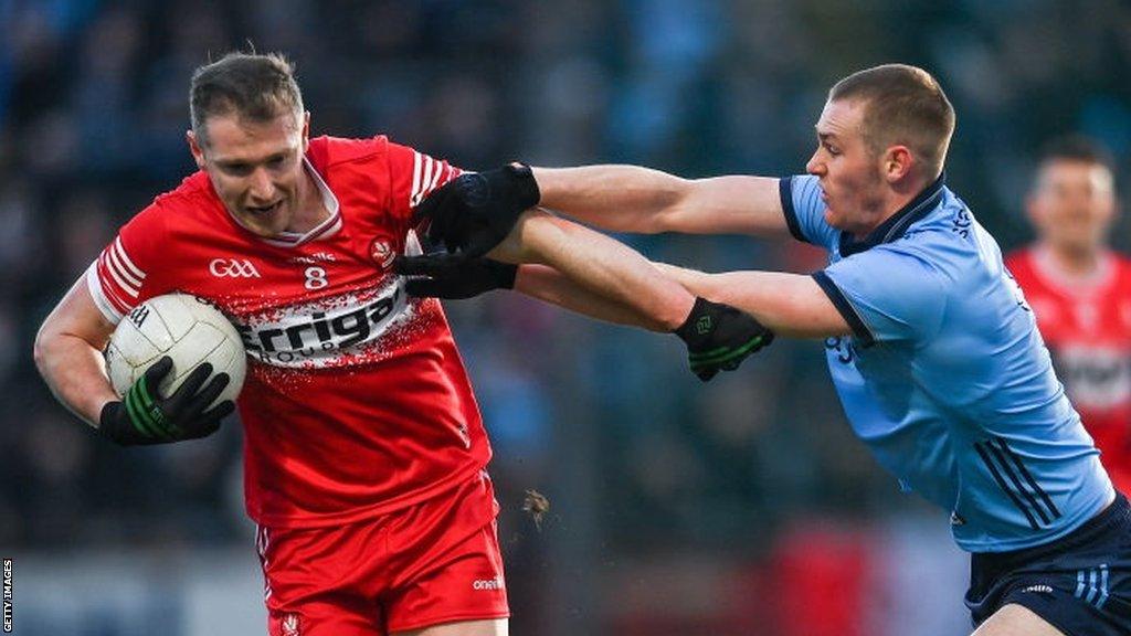 Derry's Emmet Bradley is challenged by Peadar O Cofaigh Byrne at Celtic Park