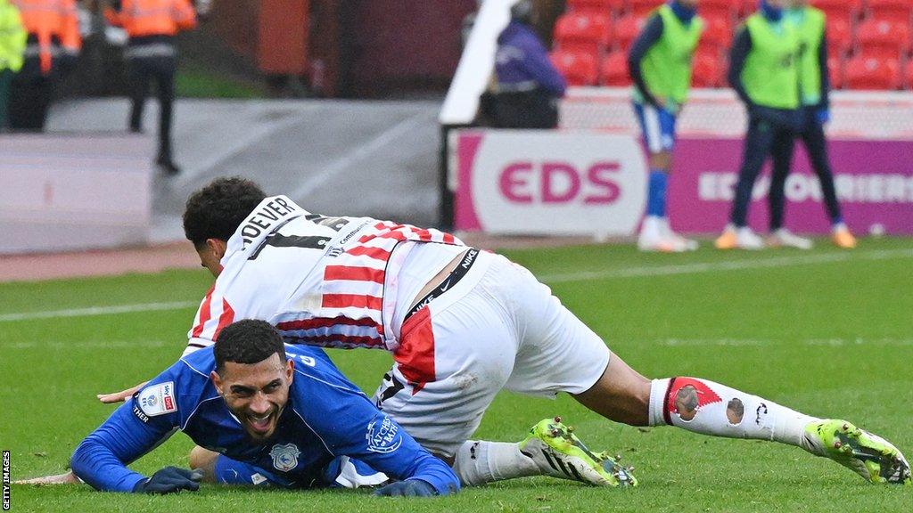 Ki-Jana Hoever of Stoke City fouls Karlan Grant of Cardiff City