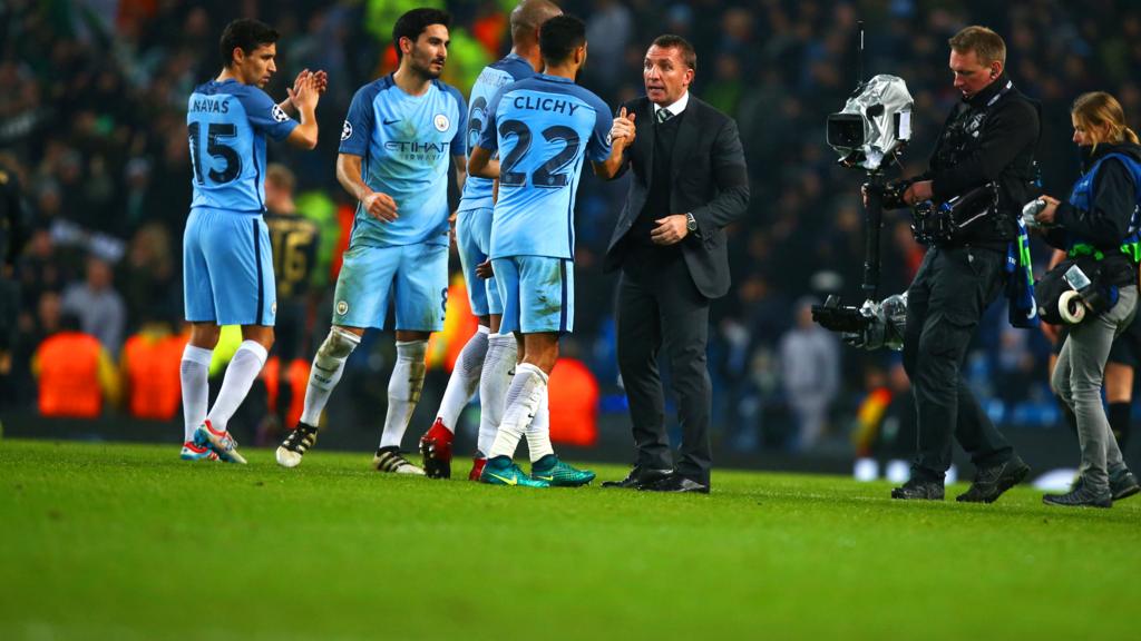 Brendan Rodgers congratulates the Manchester City team