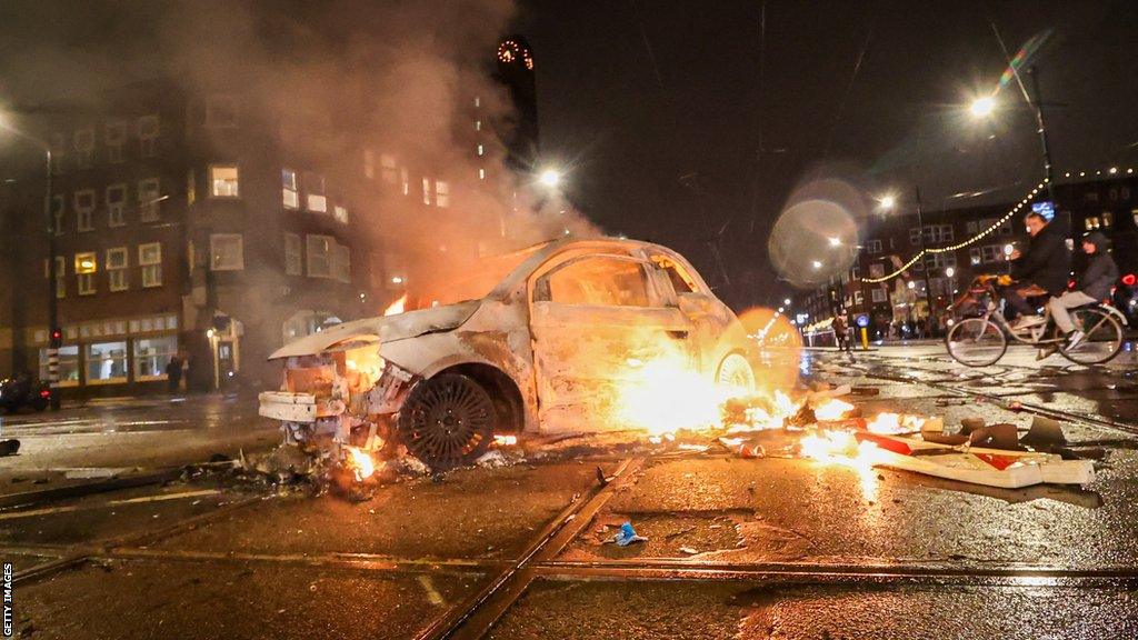 A car burns on the Mercatorplein in Amsterdam