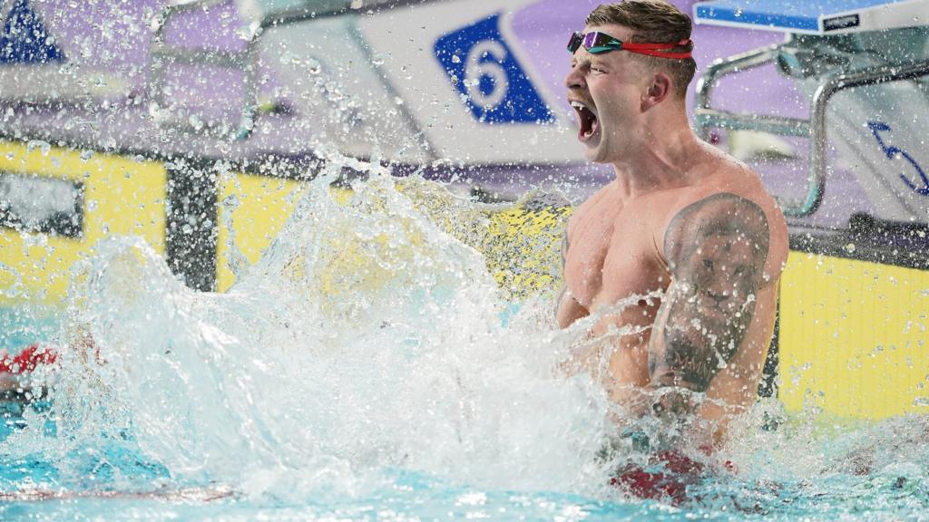 Adam Peaty celebrates