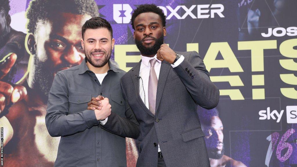 Joshua Buatsi and Ben Shalom pose in front of Boxxer backdrop