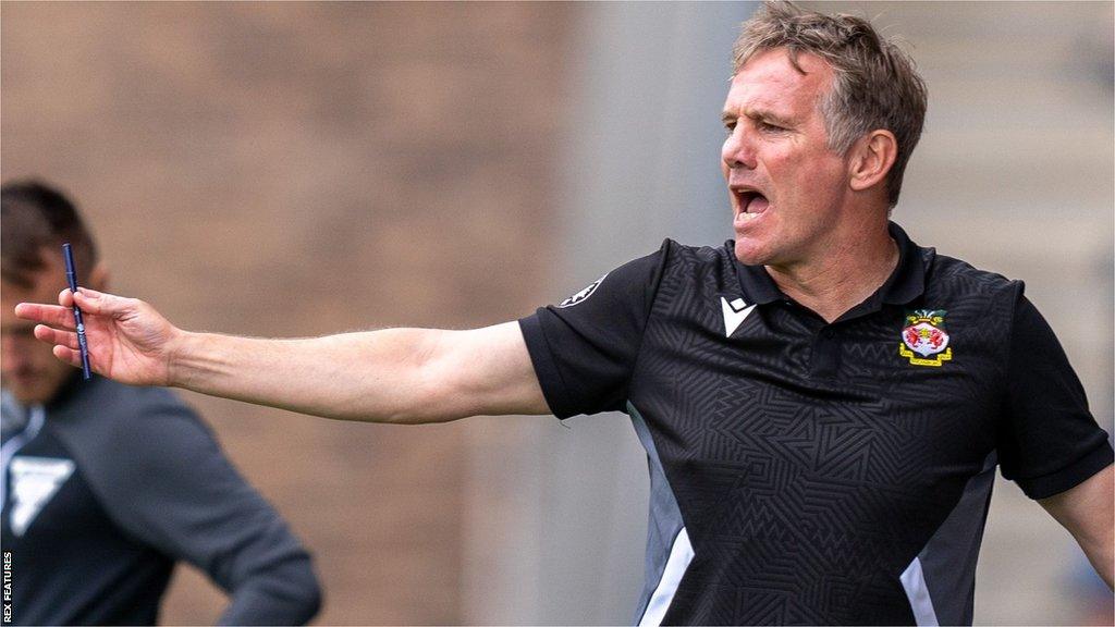 Phil Parkinson shouts instructions from the touchline