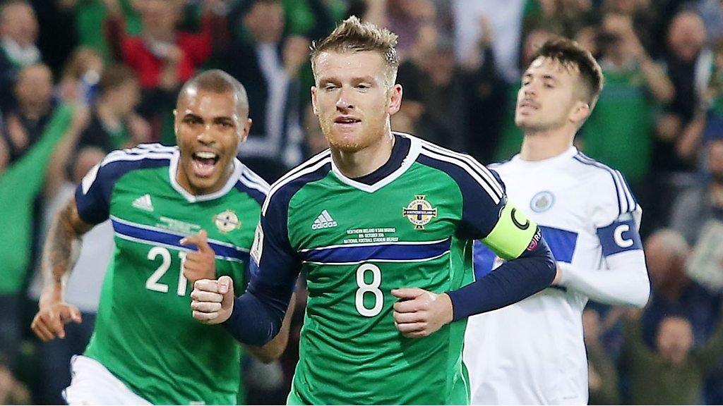 Steven Davis celebrates scoring against San Marino