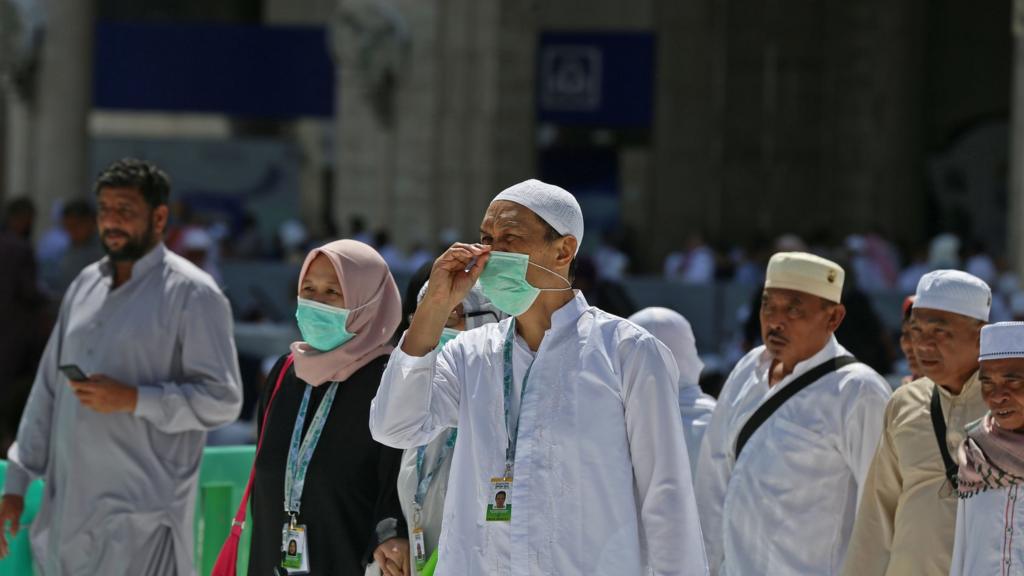 Pilgrim in Mecca wearing face masks