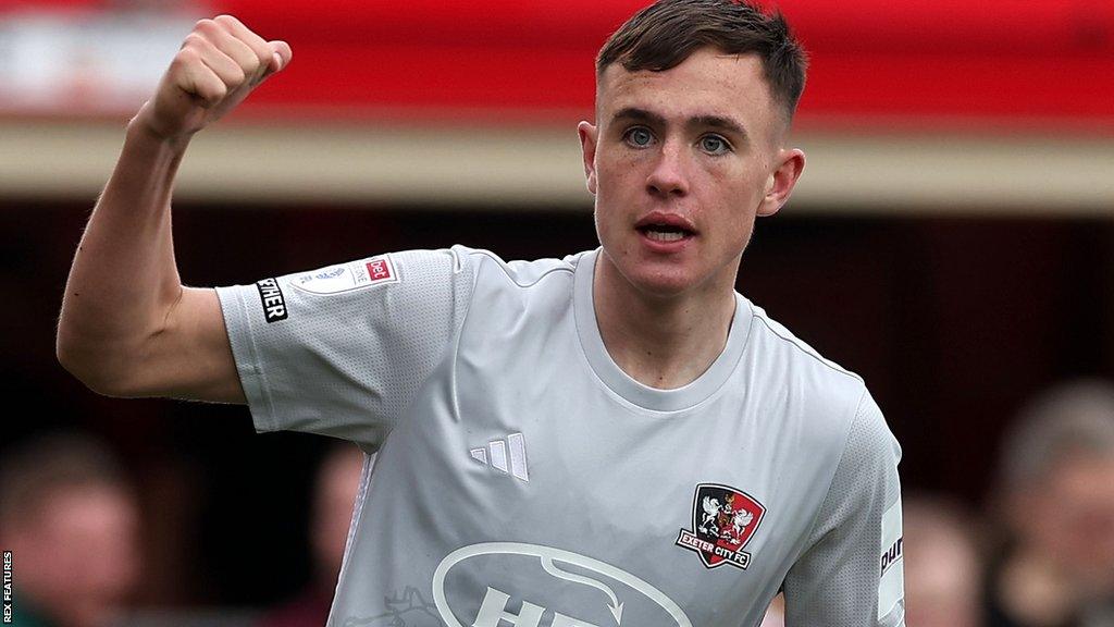 Luke Harris holds his fist up during a game