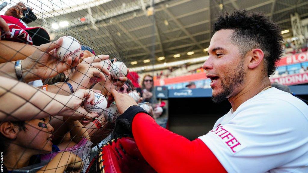 Willson Contreras signs autographs for fans at the MLB London Series in 2023