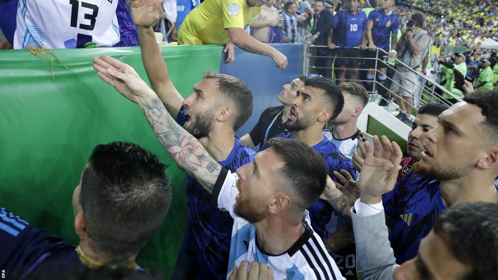 Lionel Messi speaking to police and fans to try and calm the situation