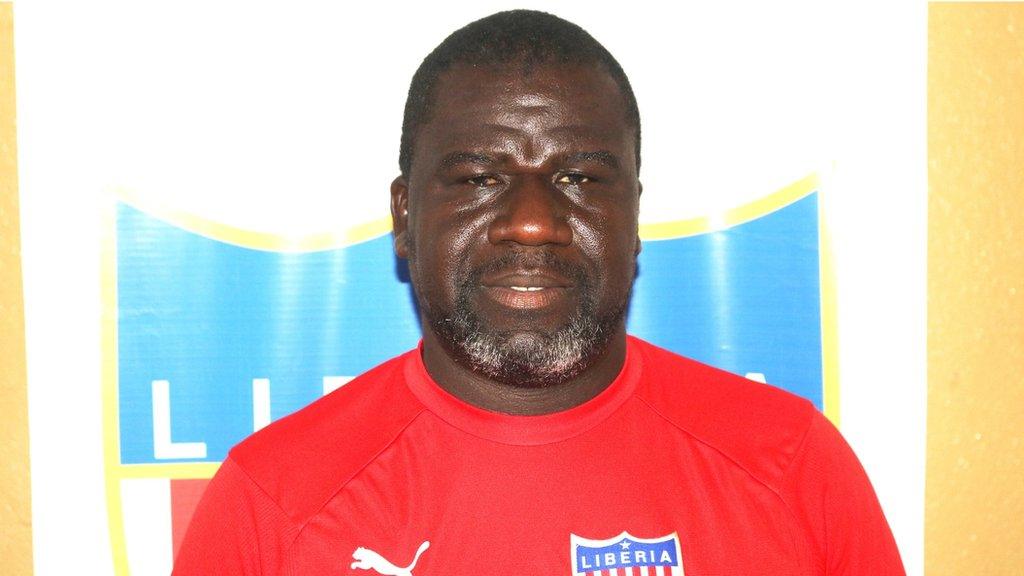 Liberia football manager Ansu Keita before a press conference