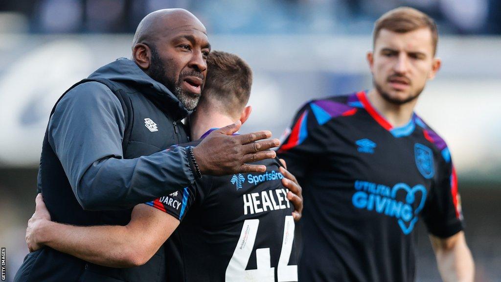 Darren Moore hugs Rhys Healey