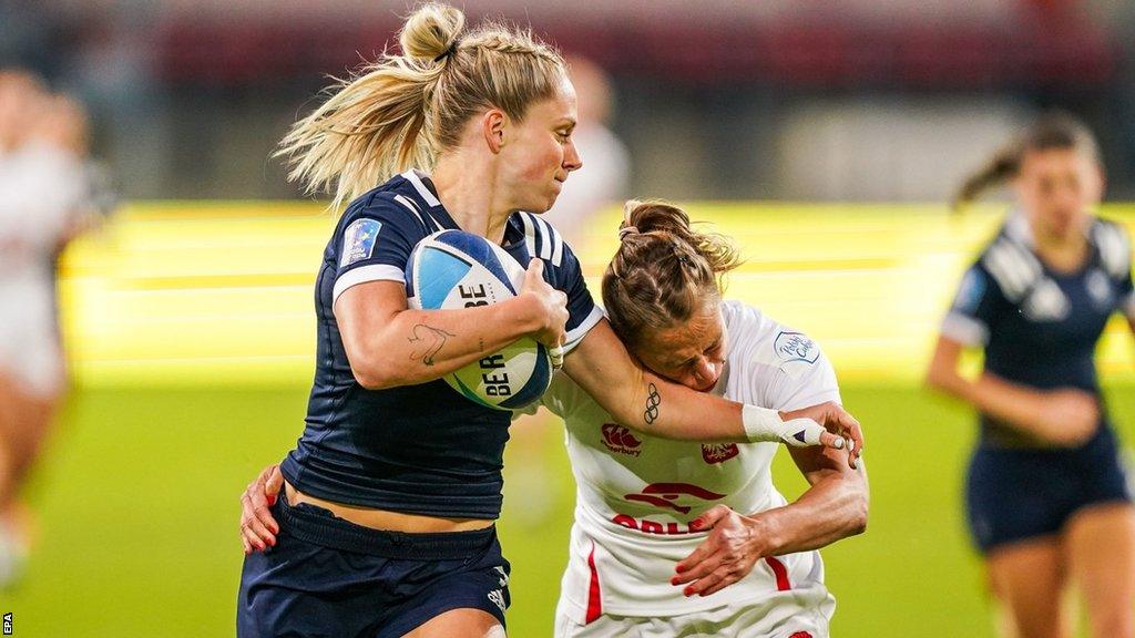 Great Britain's Emma Uren fends off Poland's Malgorzata Koldej