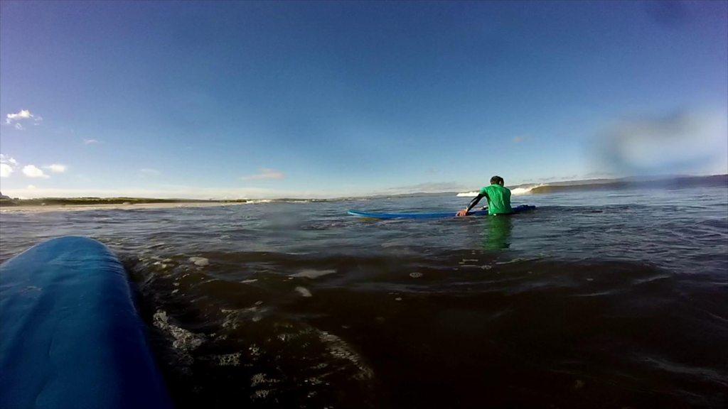 Boy surfing in sea