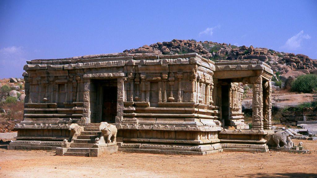 The Vittala Temple, built in the early 16th century, is devoted to the Hindu god Vithoba (also known as Vitthala and Panduranga), an incarnation of Vishnu or his avatar Krishna. Hampi is a town in northern Karnataka state.