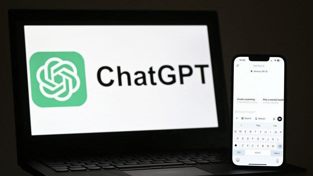 A phone and laptop screen showing the logo and interface for ChatGPT.