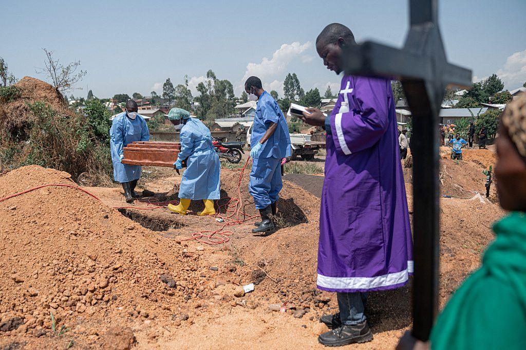 A priest conducts a blessing ceremony at Mbiyo cemetery for a fourth orphan who died from Ebola virus disease at an orphanage in Bunia, Ituri Province, June 19, 2026