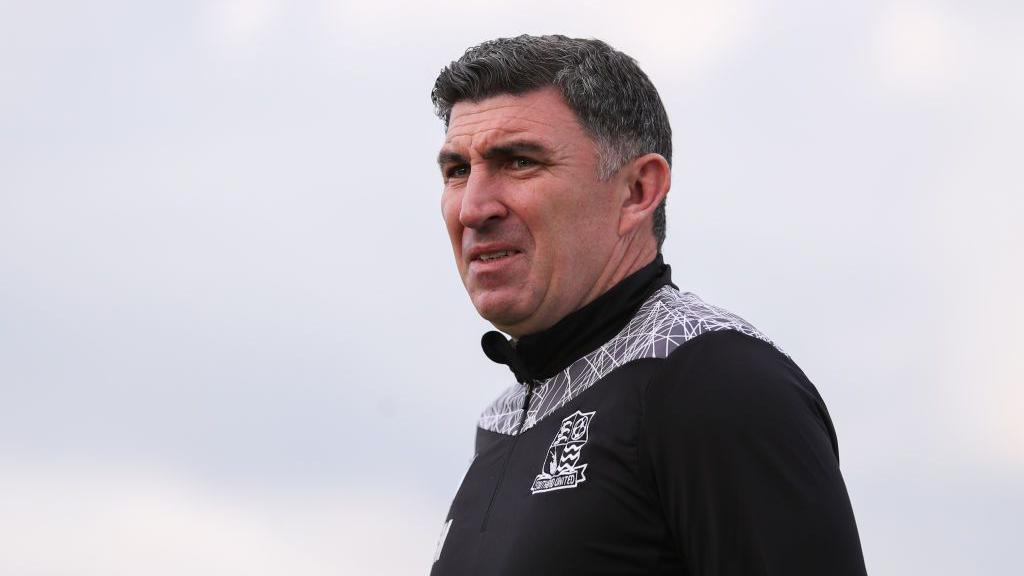 Southend boss Kevin Maher looks on during a match 