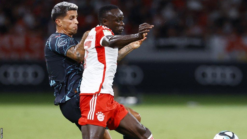 Bayern Munich's Sadio Mane in action with Manchester City's Joao Cancelo