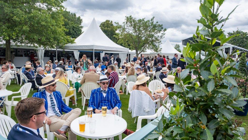 Regatta spectators having drinks