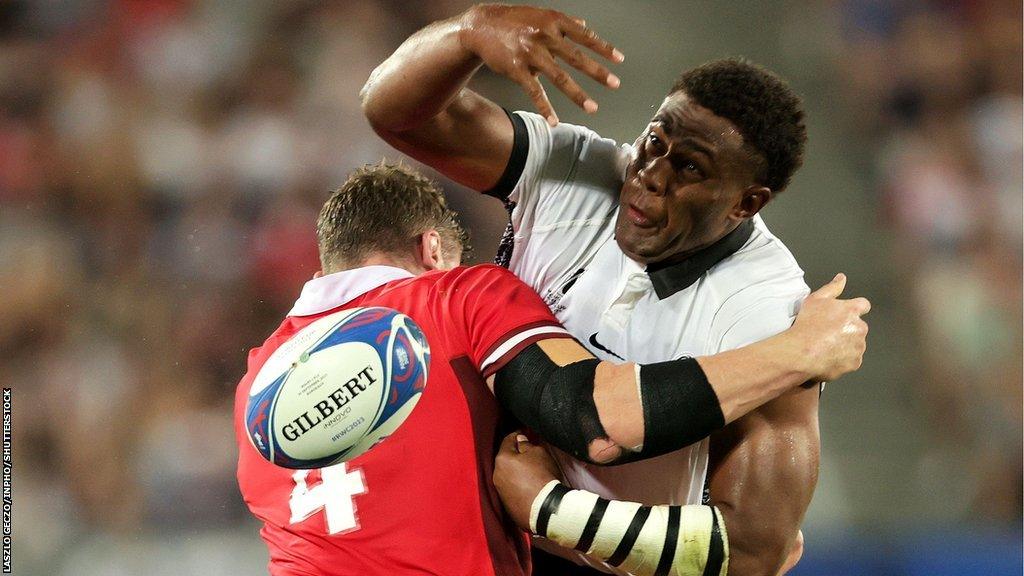 Wales Will Rowlands tackles Viliame Mata of Fiji