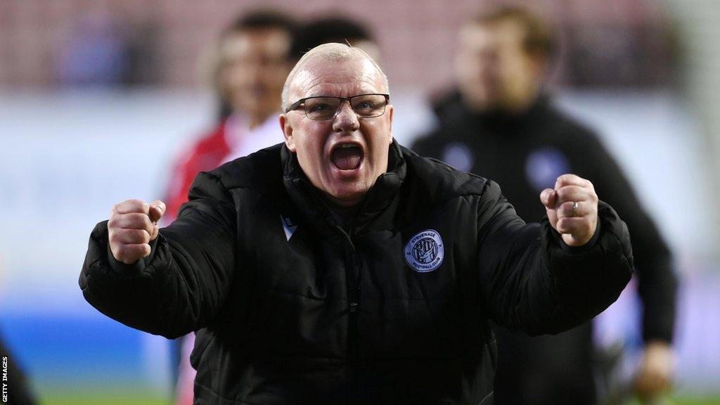 Stevenage manager Steve Evans celebrating