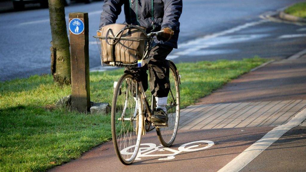 Cyclist riding bike