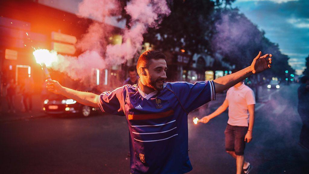 People celebrate France"s victory on the Champs Elysees