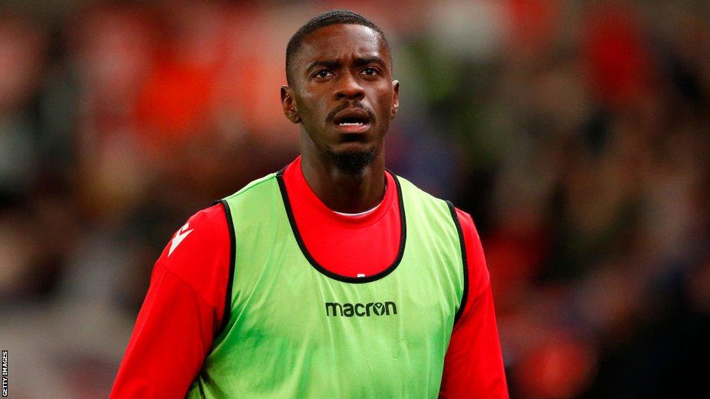 Former Manchester United defender Axel Tuanzebe warming up for Stoke