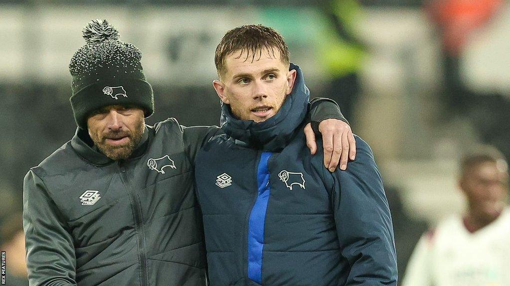 Derby manager Paul Warne hugs midfielder Max Bird