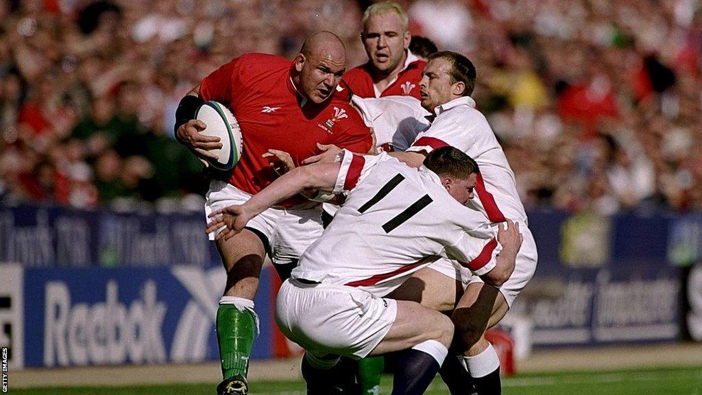 Craig Quinnell barges his way past England debutant Steve Hanley (11)