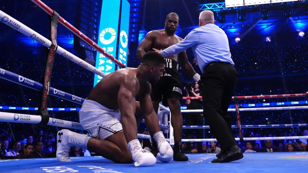 Anthony Joshua on his knees in the ring