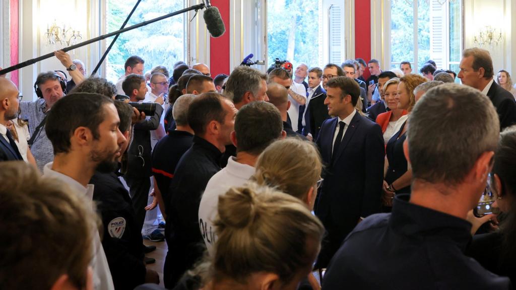 French President Emmanuel Macron meets rescuers in Annecy