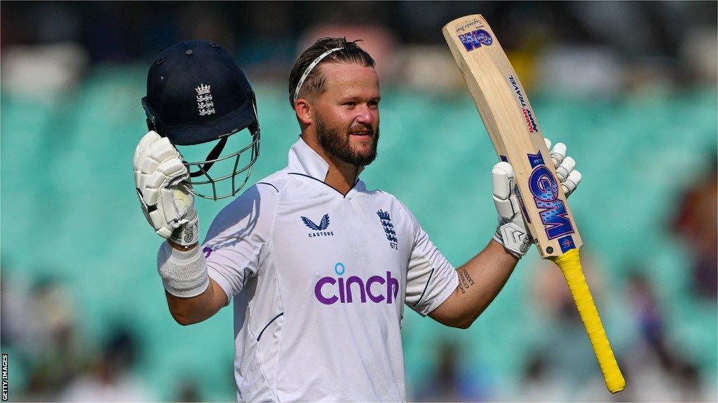 England opener Ben Duckett raises his bat and helmet after hitting a century