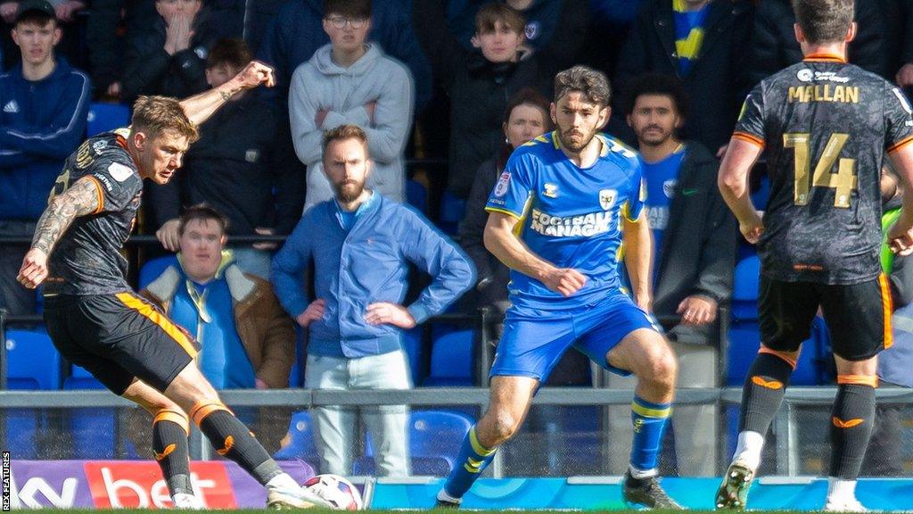 Salford City forward Callum Hendry scores against AFC Wimbledon