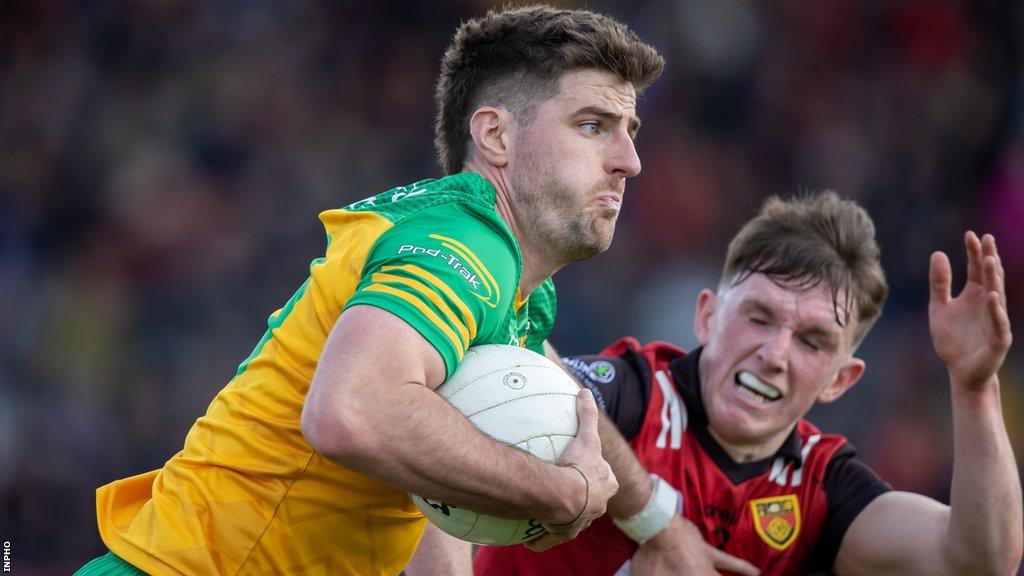 Donegal's Daire O Baoill fends off Down's Anthony Doherty at Pairc Esler