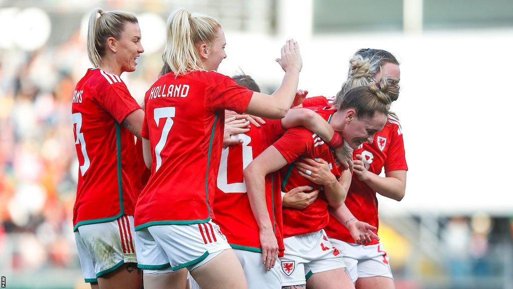 Wales celebrate Rachel Rowe's leveller against Portugal