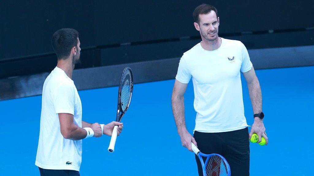 Novak Djokovic and Andy Murray talk together on the court