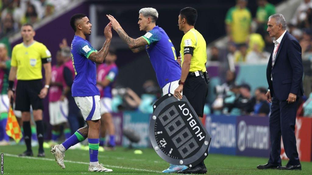 Gabriel Jesus and Pedro of Brazil high five as they are substituted during the FIFA World Cup Qatar 2022 Group G match between Cameroon and Brazil