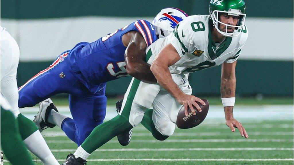 New York Jets quarterback Aaron Rodgers suffers an injury as he is sacked by Buffalo Bills defensive end Leonard Floyd