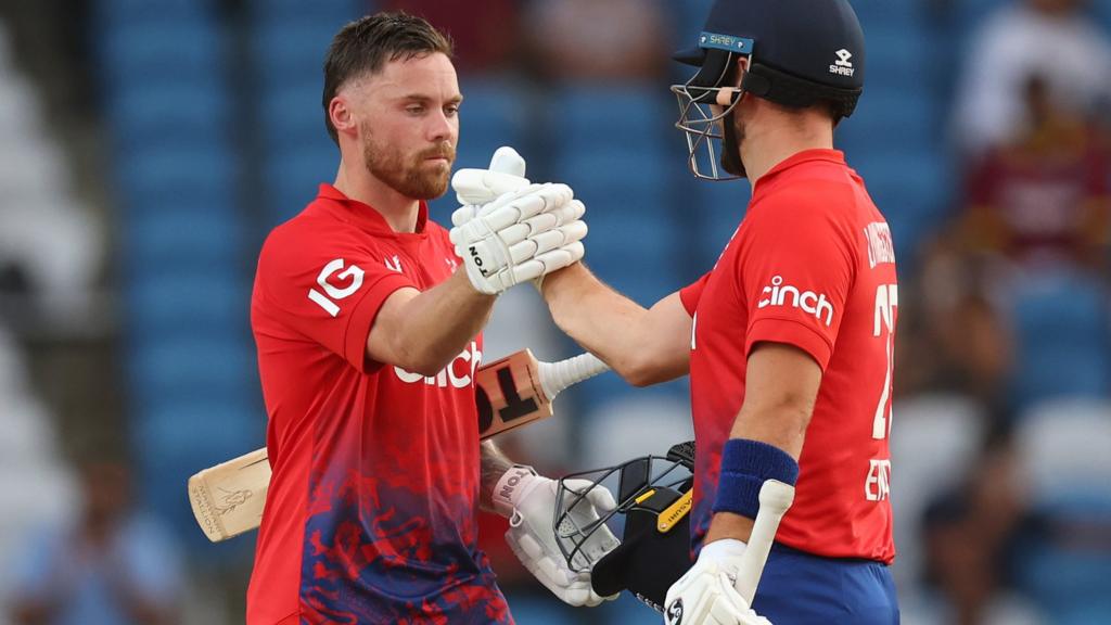 England batters Phil Salt (left) and Liam Livingstone (right) clasp hands