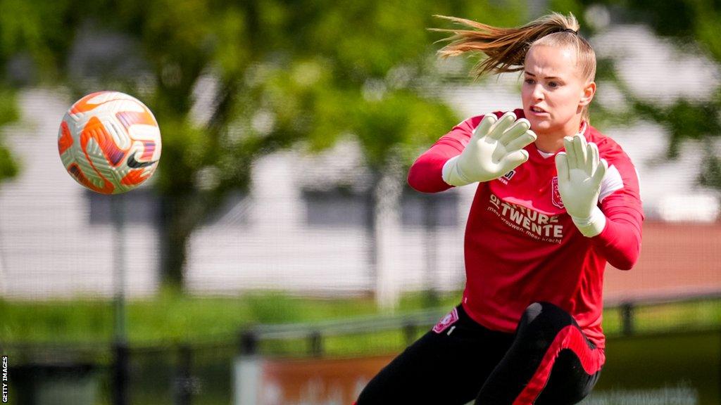 Daphne van Domselaar dives to save a ball