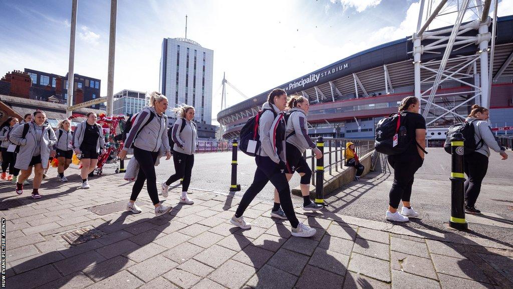 Wales players walk passed Principality Stadium