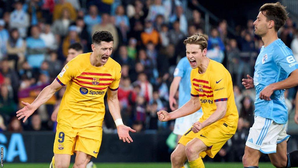 Robert Lewandowski celebrates scoring Barcelona's winner at Celta Vigo