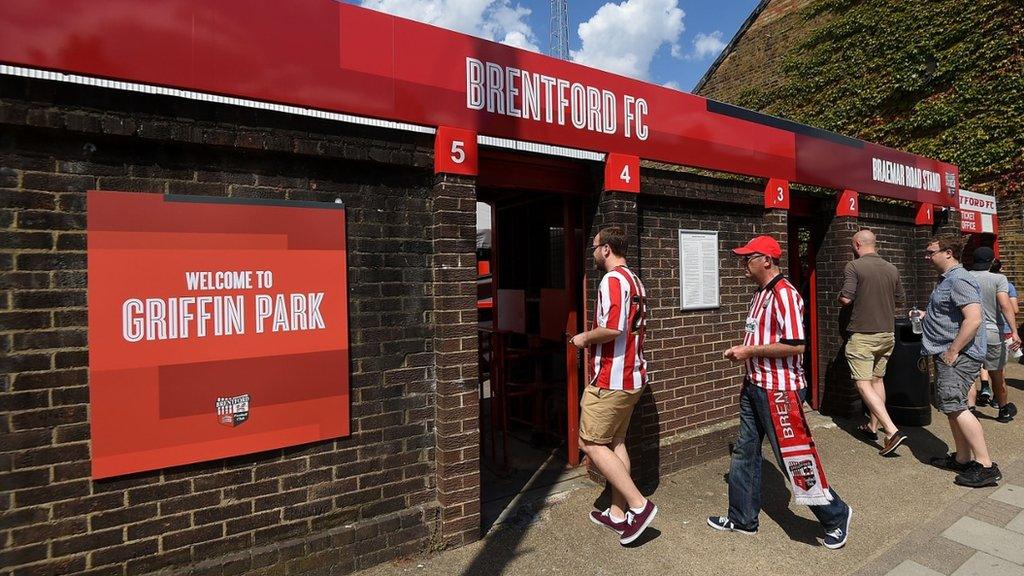 Fans enter Brentford's Griffin Park stadium