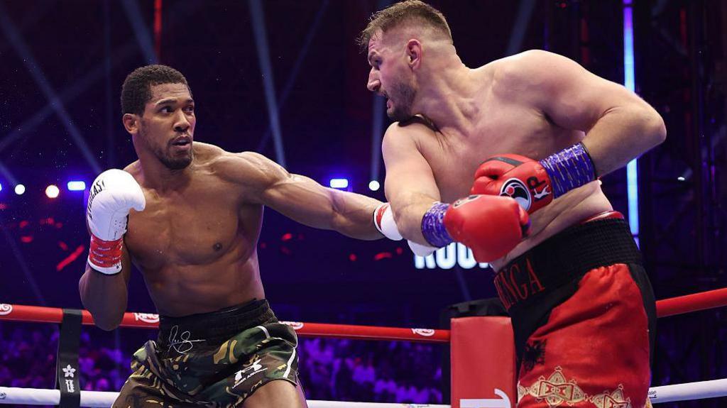 Anthony Joshua lands a punch on Kristian Prenga