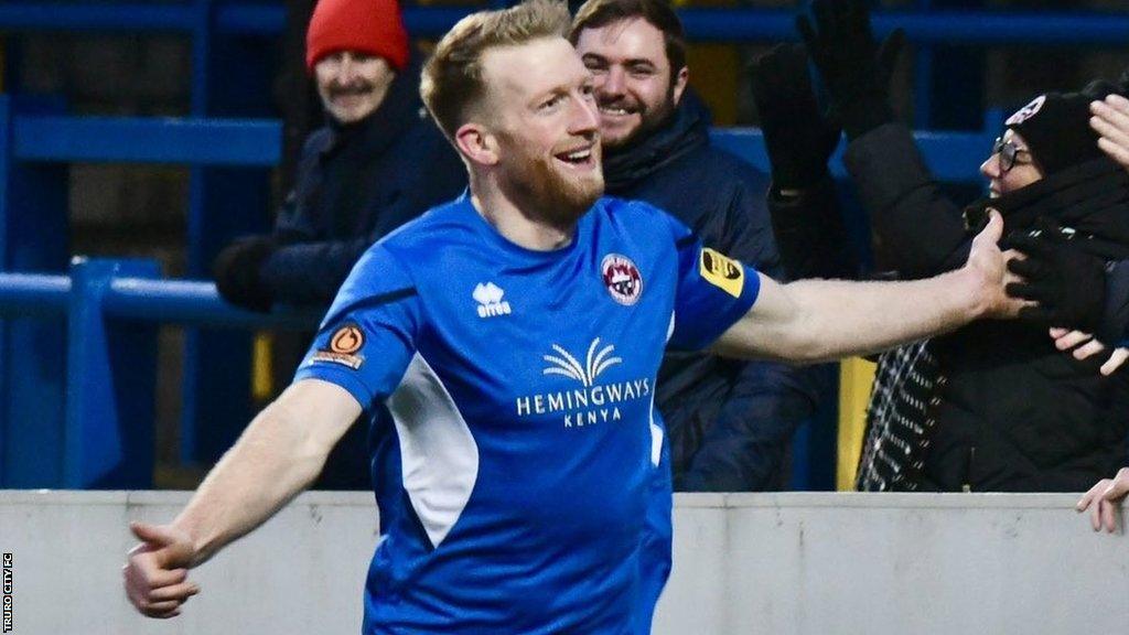 Ed Palmer celebrates scoring