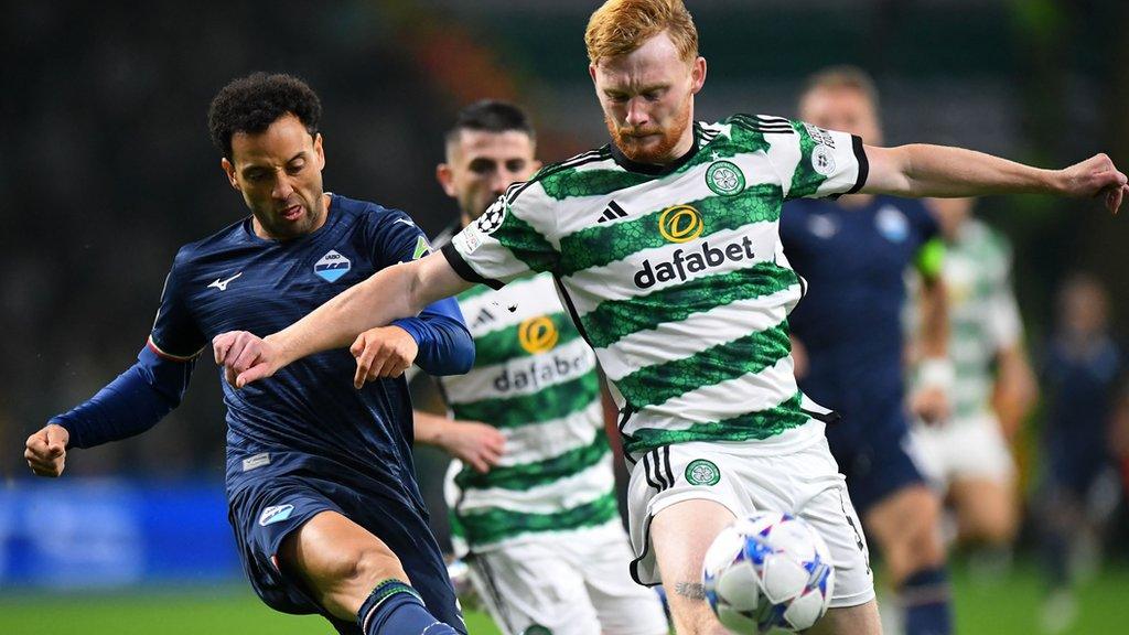 Lazio's Felipe Anderson and Celtic's Liam Scales challenge for the ball